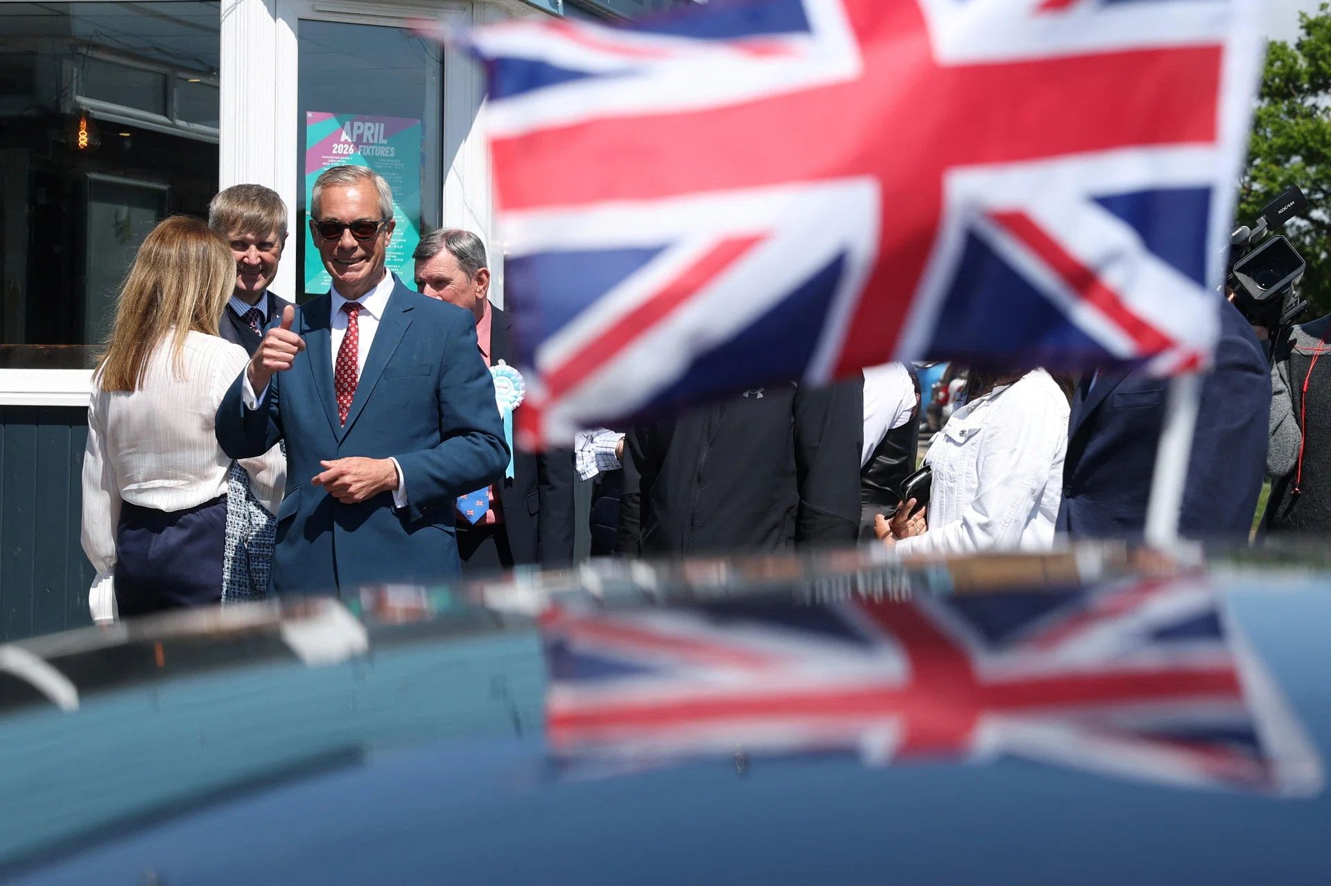 Farage racks up UK election gains as voters punish Starmer