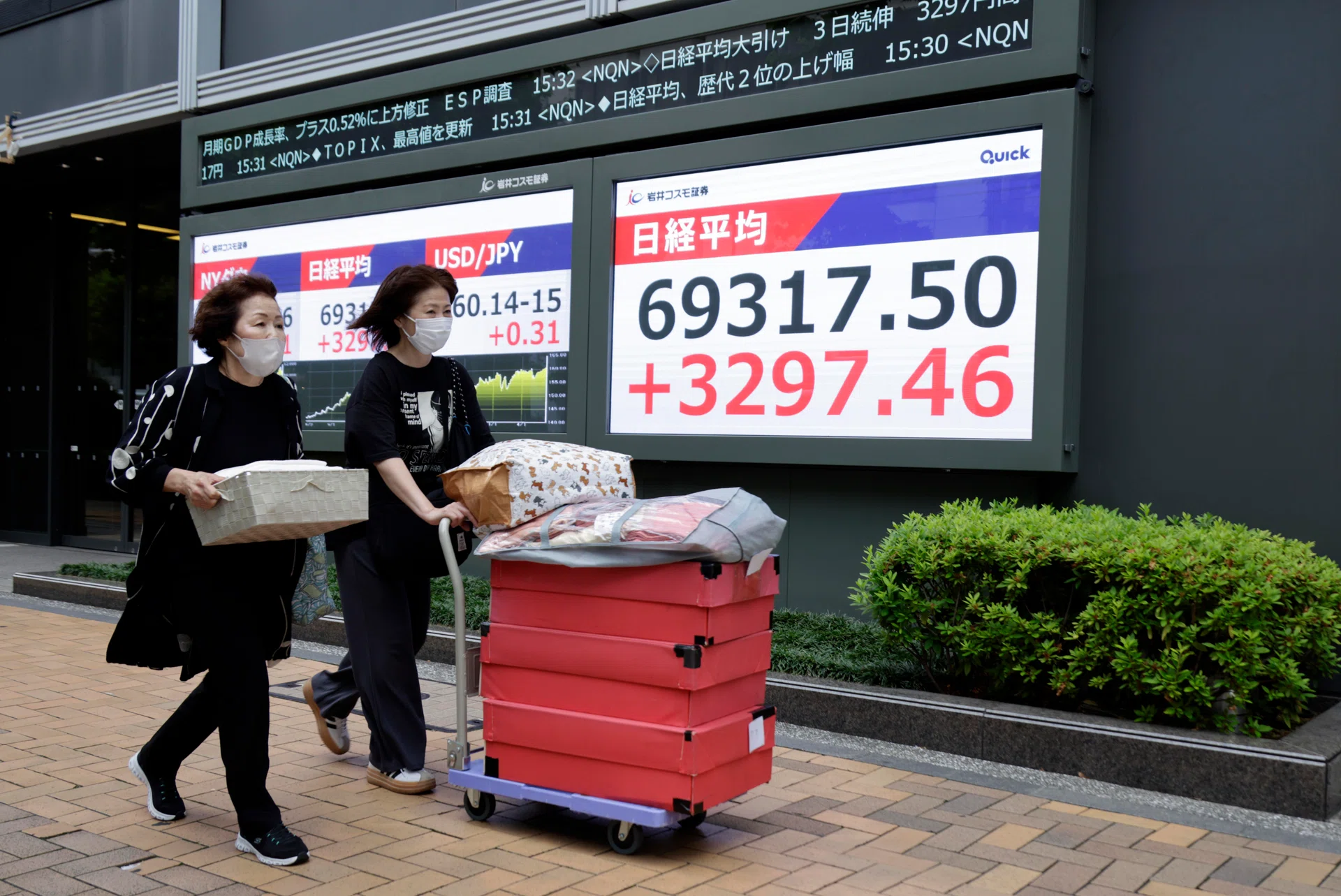 Japan’s Nikkei hits record high, yen steady after BOJ hikes rates as expected