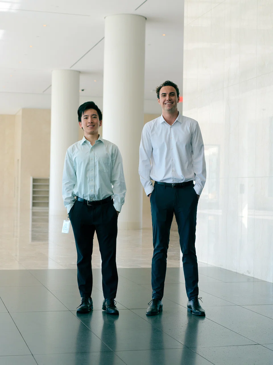 Charles Li, left, in basics from Suitsupply, and his Scotiabank co-worker Allan Bossard at Brookfield Place, a vast office-mall complex in Manhattan's financial district, on Oct 10, 2022. 