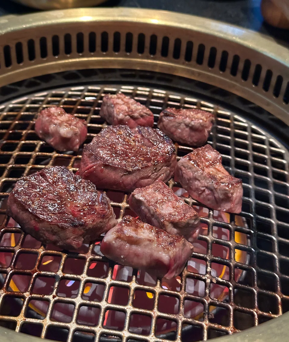 The beef is cooked over a smokeless grill. 