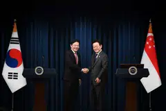 Lawrence Wong (left) shakes hands with South Korea's President Lee Jae-myung after their joint press conference in Seoul, South Korea, on Nov 2.