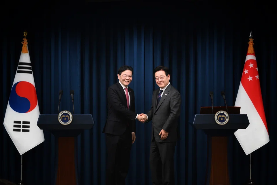 Lawrence Wong (left) shakes hands with South Korea's President Lee Jae-myung after their joint press conference in Seoul, South Korea, on Nov 2.