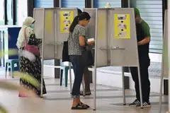 Voters casting their ballots at the polling station at Waterway Primary School on September 1, 2023.