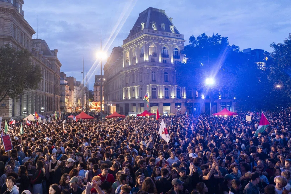 Anti-far right protesters at Place de la Republique, Paris, following the announcement of the first-round results of the French parliamentary elections.  
