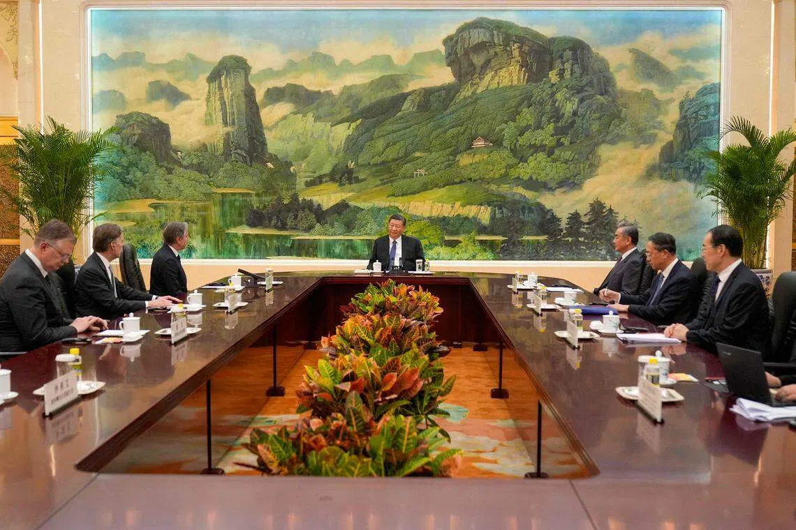China's President Xi Jinping (C) meeting with US Secretary of State Antony Blinken (3rd, L) at the Great Hall of the People in Beijing. Xi says there are still a number of issues that need to be resolved, and there is still room for further efforts.
