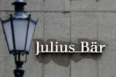 Julius Baer manages about 424.1 billion Swiss francs at year-end, making it the third-largest Swiss bank after Credit Suisse and UBS. 