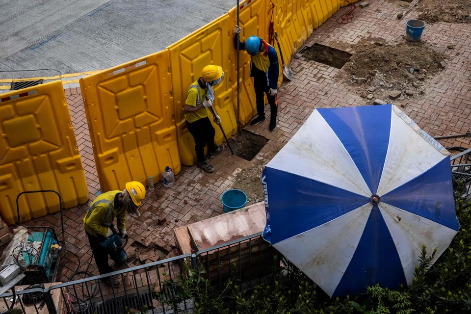 Hong Kong's government advises employers to let workers take longer breaks on hotter days but companies say the guidelines fail to consider the needs of different work environments, and activists argue that without strong regulations thousands of Hong Kong workers remain vulnerable to heat-related illnesses. 