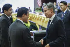 US Secretary of State Antony Blinken (right) greeting Cambodia Prime Minister Hun Manet in Vientiane, as Singapore's Prime Minister Lawrence Wong (far left) looks on.