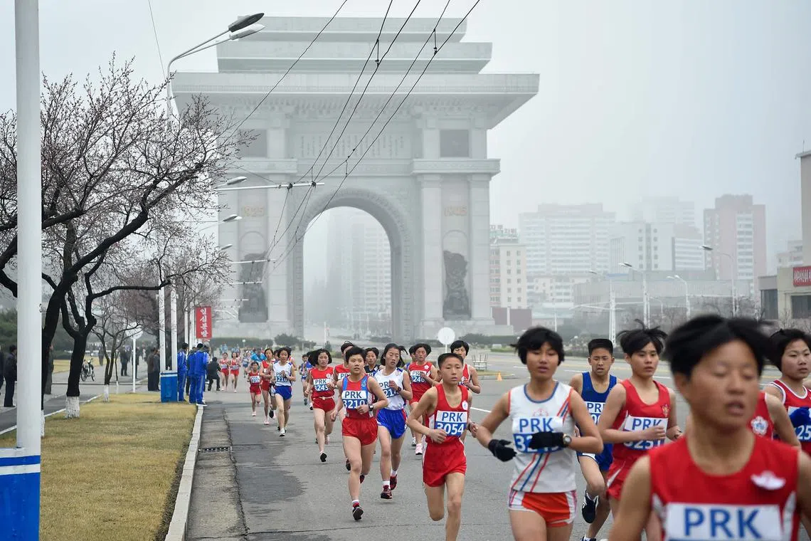 The marathon is a return course running through central Pyongyang, passing major landmarks and heading out into the countryside before coming back through the city to a stadium filled with 50,000 spectators, Koryo Tours says.