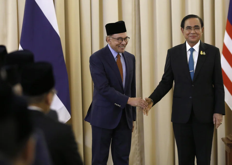 Malaysian Prime Minister Anwar Ibrahim (left) and Thai Prime Minister Prayut Chan-o-cha at the Government House in Bangkok on Thursday (Feb 9). 