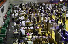 Thai voters lining up to cast ballots during the general election advance voting at a polling station in Bangkok on Sunday. More than 2.3 million eligible voters nationwide have registered to cast their votes early.