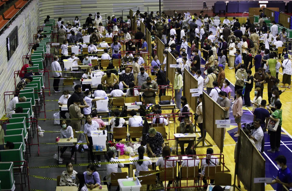 Thai voters lining up to cast ballots during the general election advance voting at a polling station in Bangkok on Sunday. More than 2.3 million eligible voters nationwide have registered to cast their votes early.
