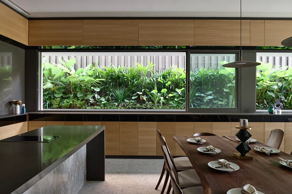 The dining area enjoys views of a side garden.