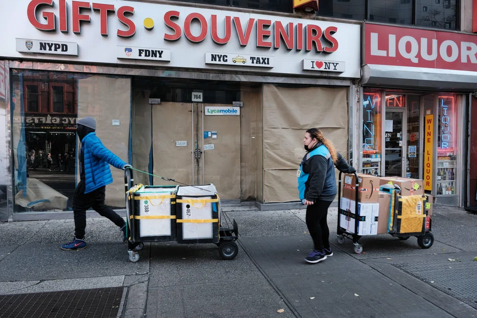 Workers making deliveries in New York City.  The job market in the United States is now strong; businesses are reluctant to let go of workers, though finance, tech and real-estate firms have let go thousands of workers in recent months. 