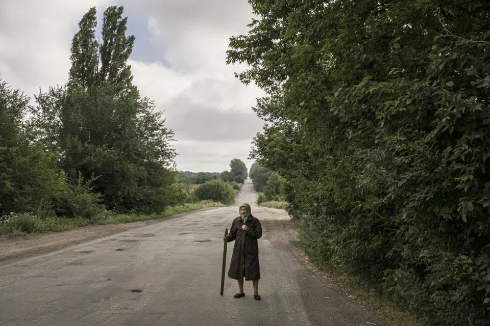 An elderly Ukrainian villager on a road on the outskirts of Dibrova on July 23, 2022. The relative balance of risks between demography and climate is changing.