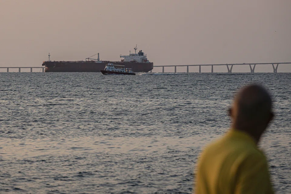 An oil tanker is seen from the Lake Maracaibo boardwalk in Maracaibo, Venezuela, Dec 17, 2025. The US is in pursuit of an oil tanker flying under a false flag in Venezuela. 