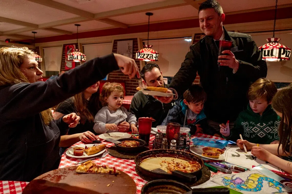 Erik Vanston, Jessica Pizano and their family dine at a Pizza Hut Classics in Tunkhannock, Pennsylvania, Feb 25, 2026.