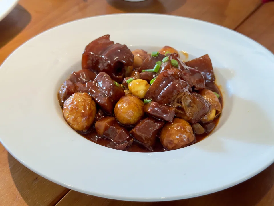 The spicy braised pork belly with garlic and quail eggs.