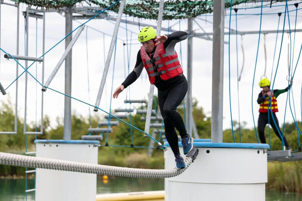 Hijinks campaigning: Ed Davey, leader of the Liberal Democrats, attempting an aqua jungle ropes course at a water park in Stratford-upon-Avon on Jun 12.  