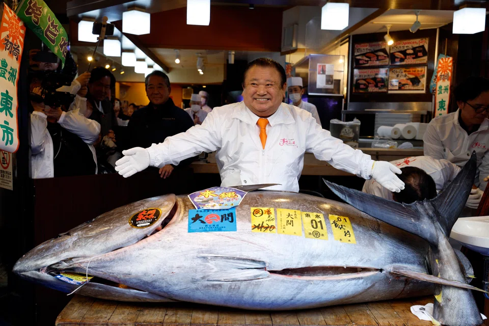 Kiyoshi Kimura, Kiyomura chief, with the 243 kg Bluefin tuna fish he bought at auction for a record price of 510 million yen.