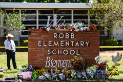 Flowers placed at a makeshift memorial in front of Robb Elementary School in Uvalde, Texas, May 25, 2022.