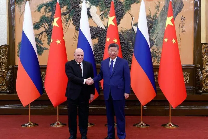 The Kremlin has highlighted the significance of Mishustin’s (L) visit at a time when Russia is under major Western sanctions over its war in Ukraine and looking to stem a recent slowdown in trade with China.