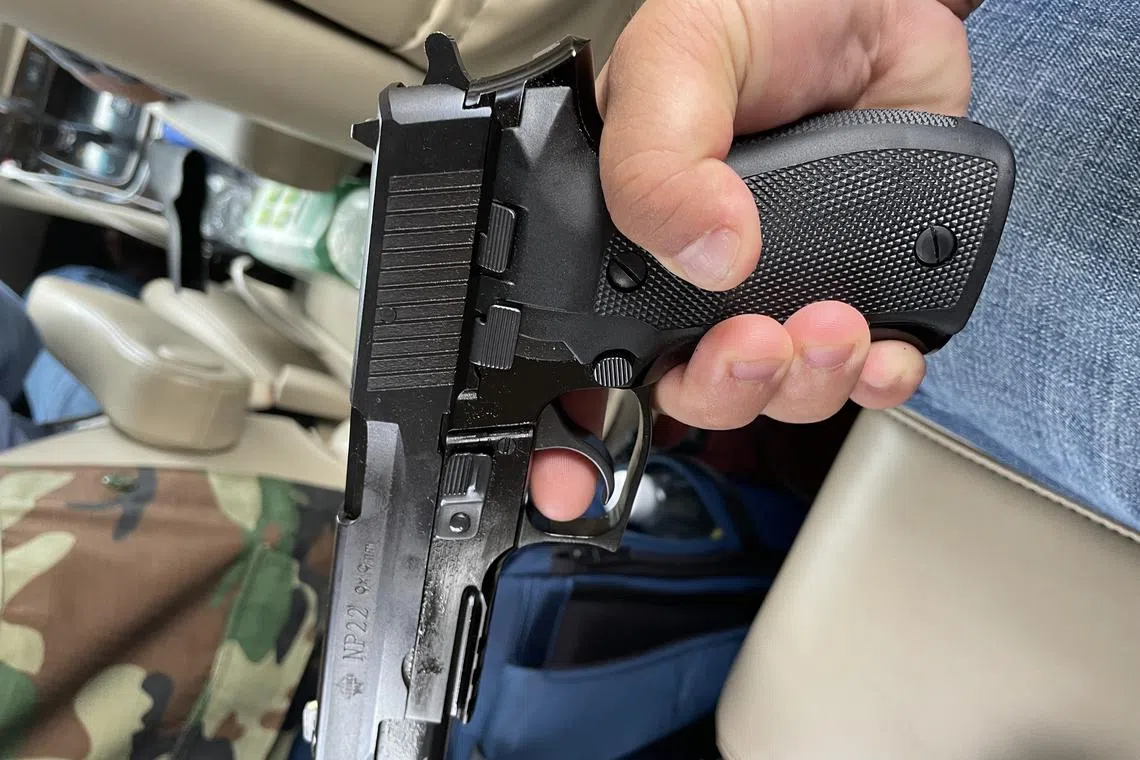 With guns being common in Sihanoukville, the driver hired by the reporter himself carries a China-made NP22 pistol for self defence.