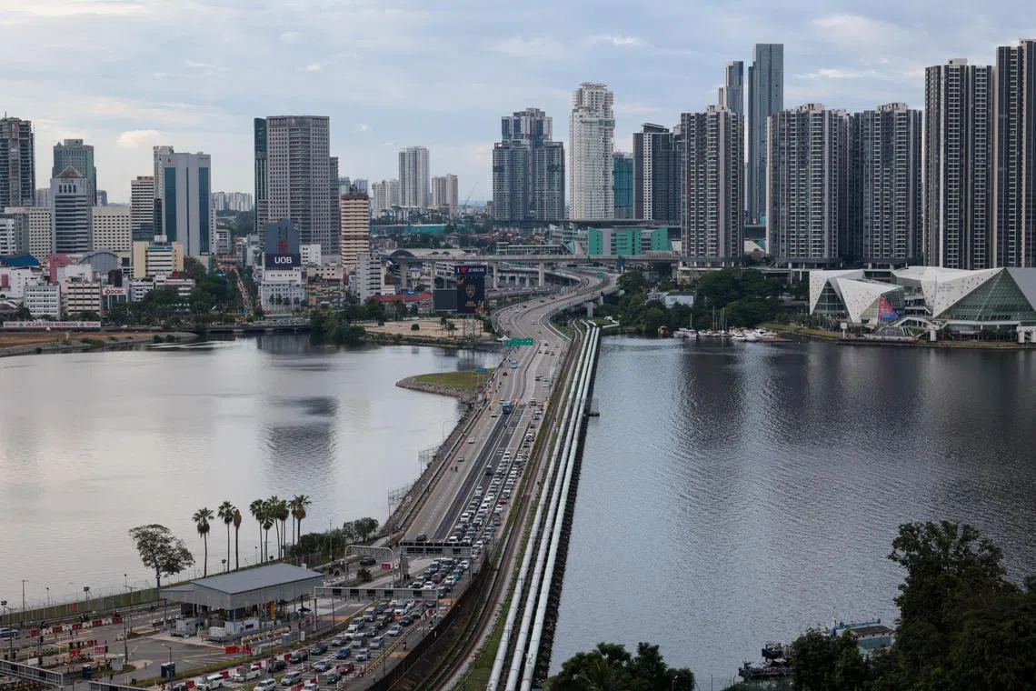 Traffic congestion on the causeway linking  Johor Bahru and Singapore. Measures to ease the flow of people and goods could increase the allure of the JS-SEZ.