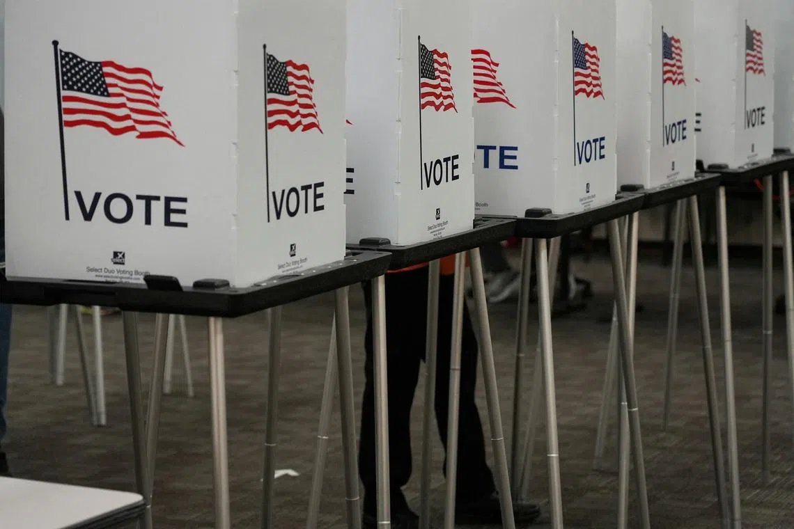 Voting booths are pictured inside the Dona Ana County Government Centre during early voting for the upcoming midterm elections in Las Cruces, New Mexico, US, October 24, 2022.  