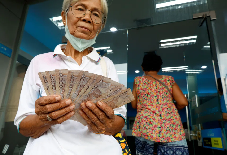 Thailand kicked off a US$14 billion stimulus plan, giving 10,000 baht (S$395) to 45 million citizens to boost spending and economic growth, despite concerns over fiscal responsibility.