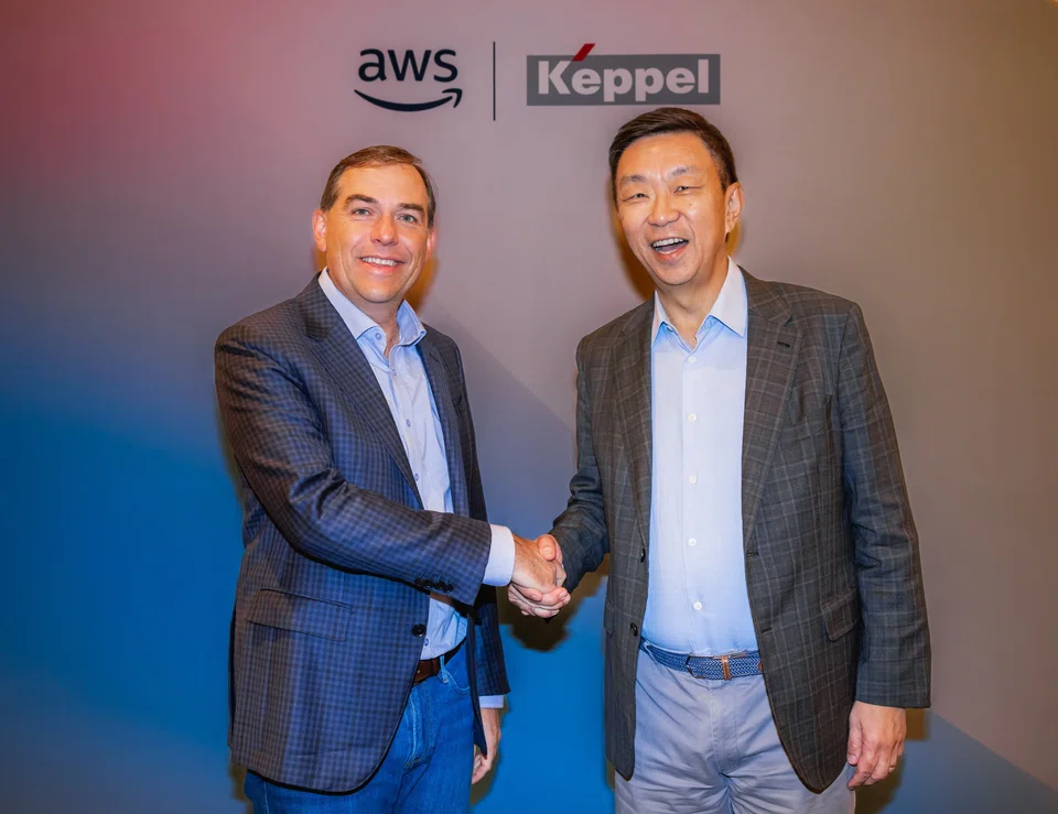 Amazon Web Services chief executive Matt Garman (left) and Keppel chief executive Loh Chin Hua at the ceremonial signing event in Las Vegas. 