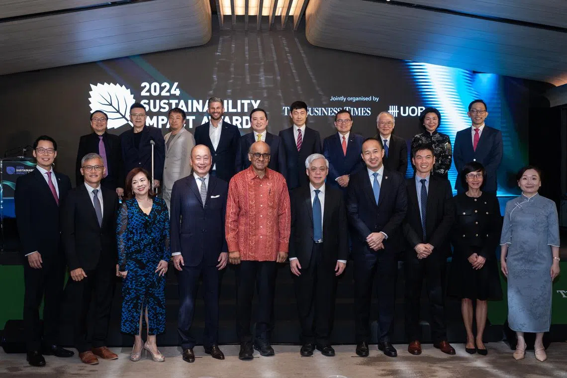 Front row: President Tharman Shanmugaratnam (fifth from left), UOB chief executive Wee Ee Cheong (fourth from left) and BT editor Chen Huifen (first from right), with winners of the Sustainability Impact Awards 2024.