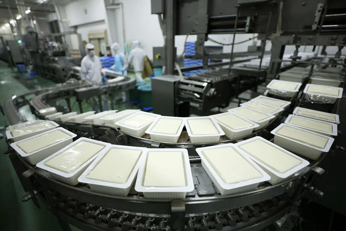 Packs of tofu moving on a production line at a factory in Japan. Going forward, supply chain management will increasingly focus on driving efficiency and reduction in waste. 