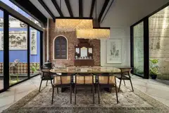 In the kitchen are new alcoves set into the brick walls, a new dining table and dining chairs.