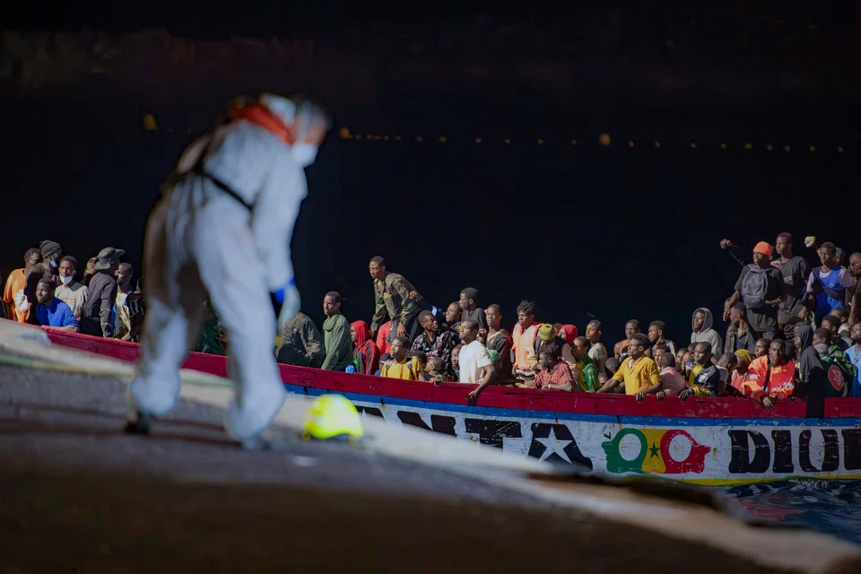 Migrants on a boat arriving at the Canary island of El Hierro. Tens of millions of people are likely to flee Africa and Latin America in the coming years, driven by political and economic challenges and climate change. 