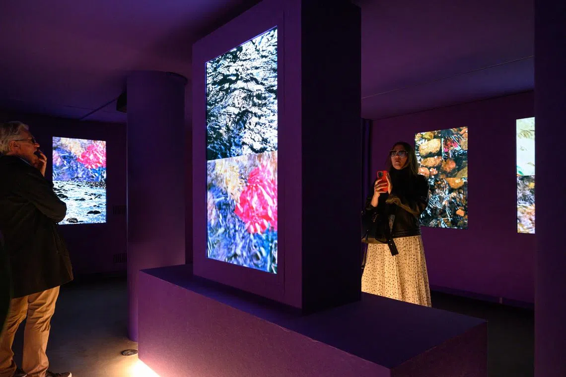Visitors viewing “Listening All Night to the Rain” in the British Pavilion during preview week of the Venice Biennale in April.