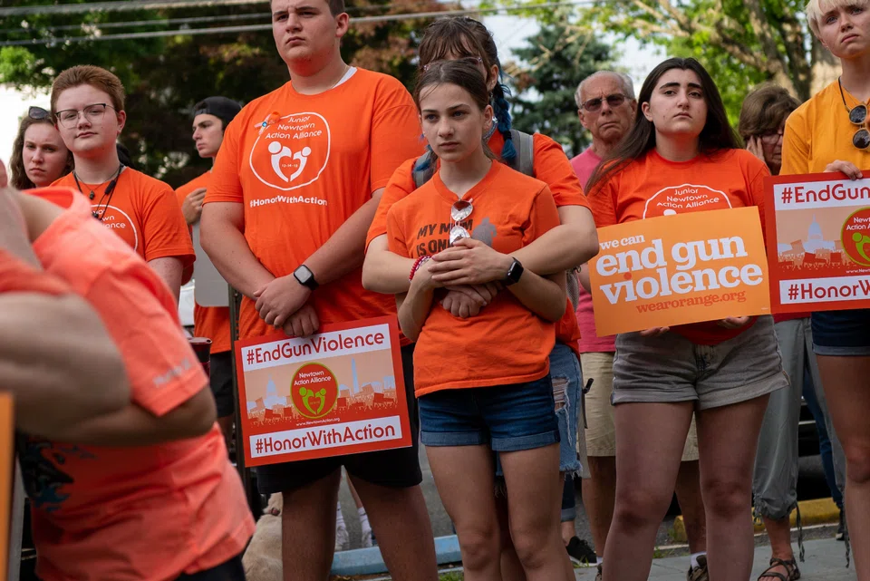 NEWTOWN, CONNECTICUT - JUNE 03: People attend a rally for National Gun Violence Awareness Day on June 03, 2022 in Newtown, Connecticut. Across the nation people are wearing orange and joining rallies as they demand change to America's gun laws.   
