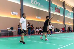 Wong Kee Joo (left), chief executive of HSBC Singapore, with Loh Kean Yew at the badminton coaching clinic.