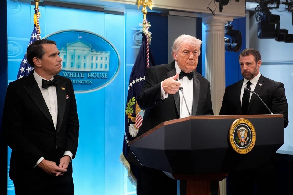 (From left) Acting US Attorney General Todd Blanche, President Donald Trump and Secretary of the US Department of Homeland Security Markwayne Mullin at a news conference at the White House on Apr 25.