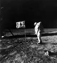 Astronaut Edwin Aldrin stands by the American flag on the lunar surface during the Apollo 11 mission in July 1969.