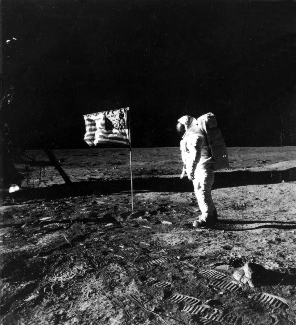 Astronaut Edwin Aldrin stands by the American flag on the lunar surface during the Apollo 11 mission in July 1969.
