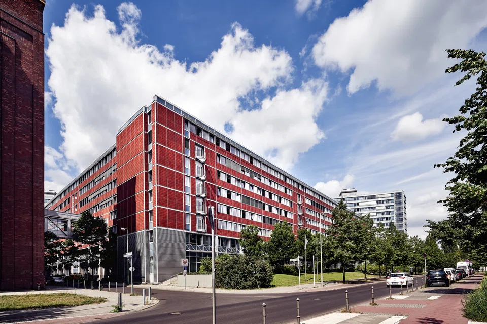 The Reit manager says that it will divest half of its Berlin Campus asset after securing a long-term tenant.