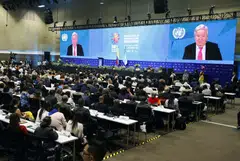 Attendees watch a video from the United Nations Secretary-General Antonio Guterres at the 2024 UN Biodiversity Conference (COP16) in Cali, Colombia, Oct 20, 2024. 