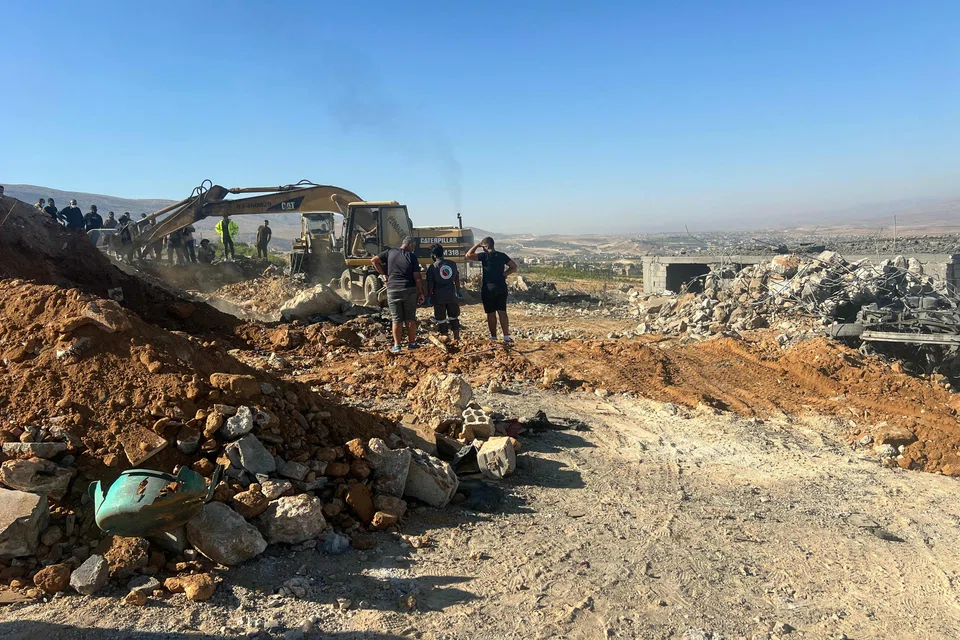Rescuers remove the rubble of a house levelled overnight by an Israeli air strike in Lebanon's eastern Bekaa valley on Sunday.