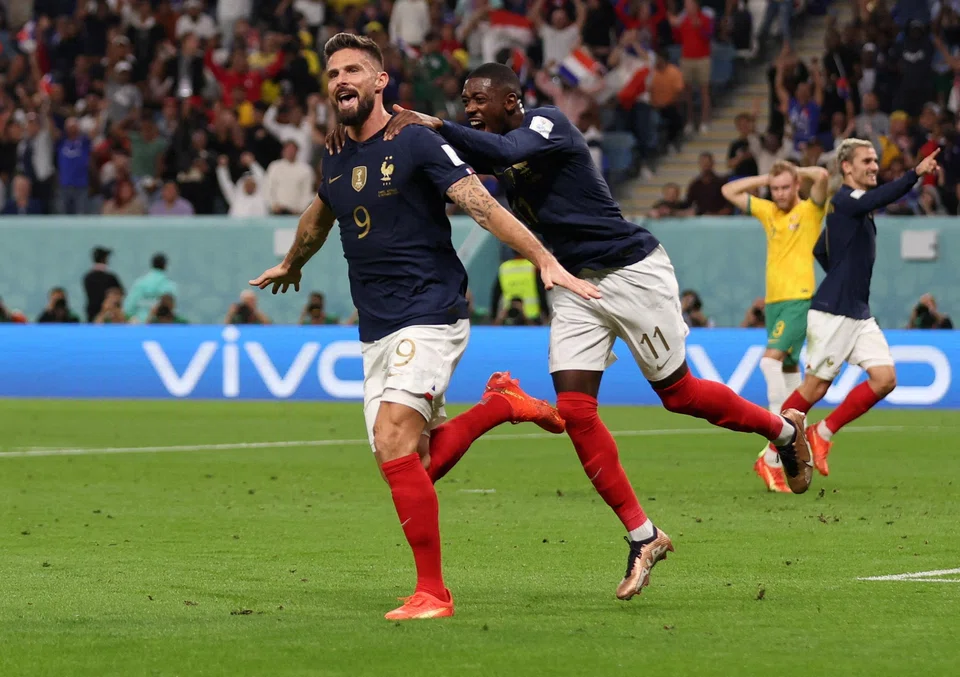 France's Olivier Giroud celebrates scoring their second goal with Ousmane Dembele in their World Cup tie against Australia.  