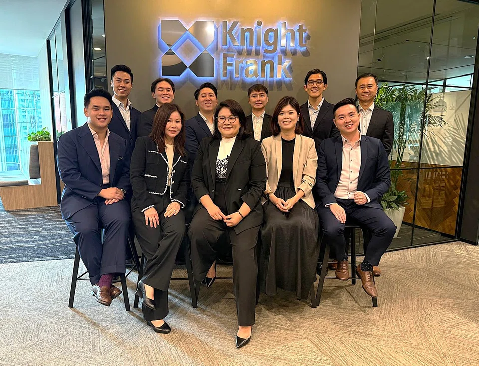 Tridiana Ong (front row, centre) leads a team of 16, including three brokers who previously worked with her at Colliers Singapore. 