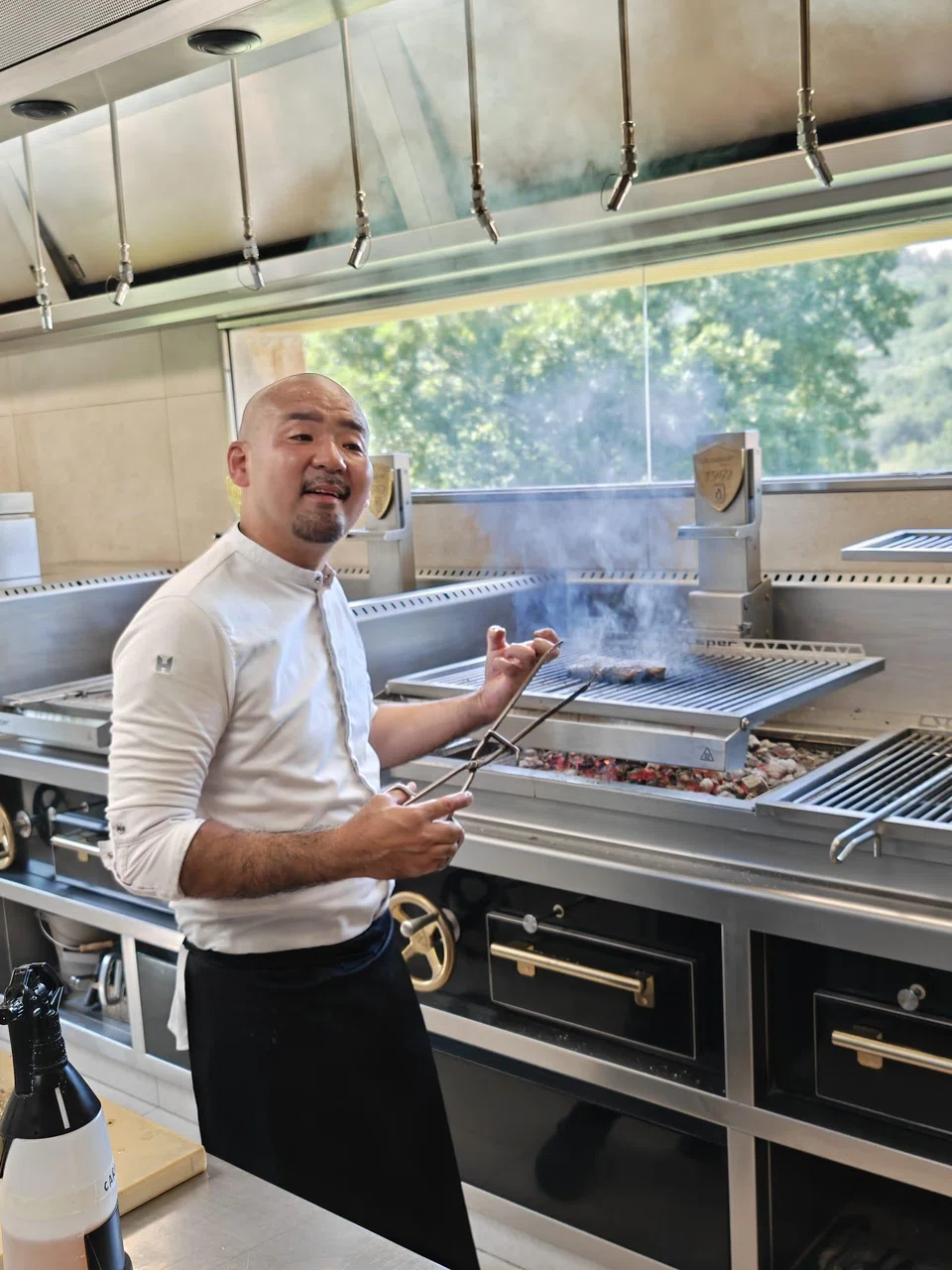 The chef at Txispa, a restaurant about 500 km from Barcelona, grilling a perfect steak.