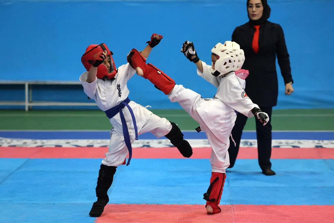 As more women turn to karate, the sport has become a symbol of Iran’s changing society, where a young, urban generation is quietly challenging traditional gender roles and societal norms.