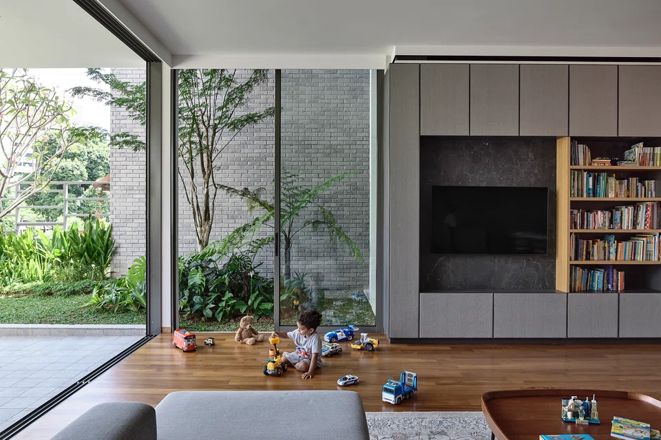 The second floor living room has ample outdoor play areas.