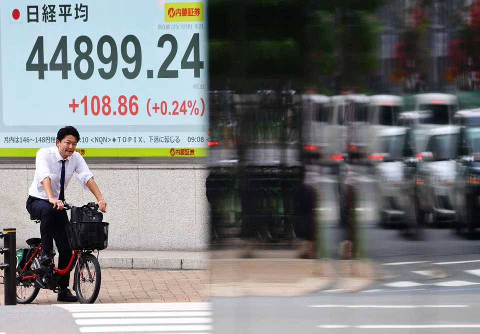 The Nikkei rose as the Fed decision boosted the dollar against the yen and other currencies, helping Japanese exporters, while Hong Kong and Shanghai swung in and out of positivity.